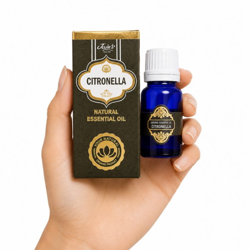 Aceite Esencial de Citronela Jain's 100% natural con caja decorativa y frasco de vidrio azul sobre fondo blanco.
