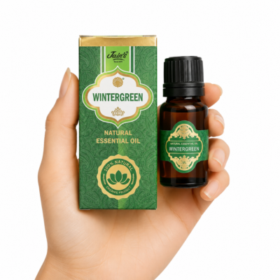 Aceite Esencial de Wintergreen Jain's 100% natural con caja verde y frasco de vidrio ámbar sobre fondo blanco.