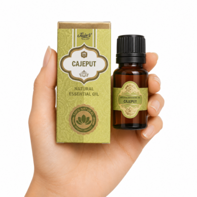 Aceite Esencial de Cajeput Jain's 100% natural con caja decorativa y frasco de vidrio ámbar sobre fondo blanco.