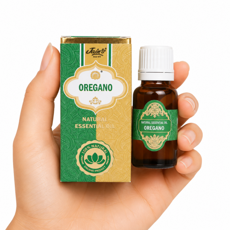 Aceite Esencial de Orégano Jain's 100% natural con caja verde y dorada y frasco de vidrio ámbar sobre fondo blanco.