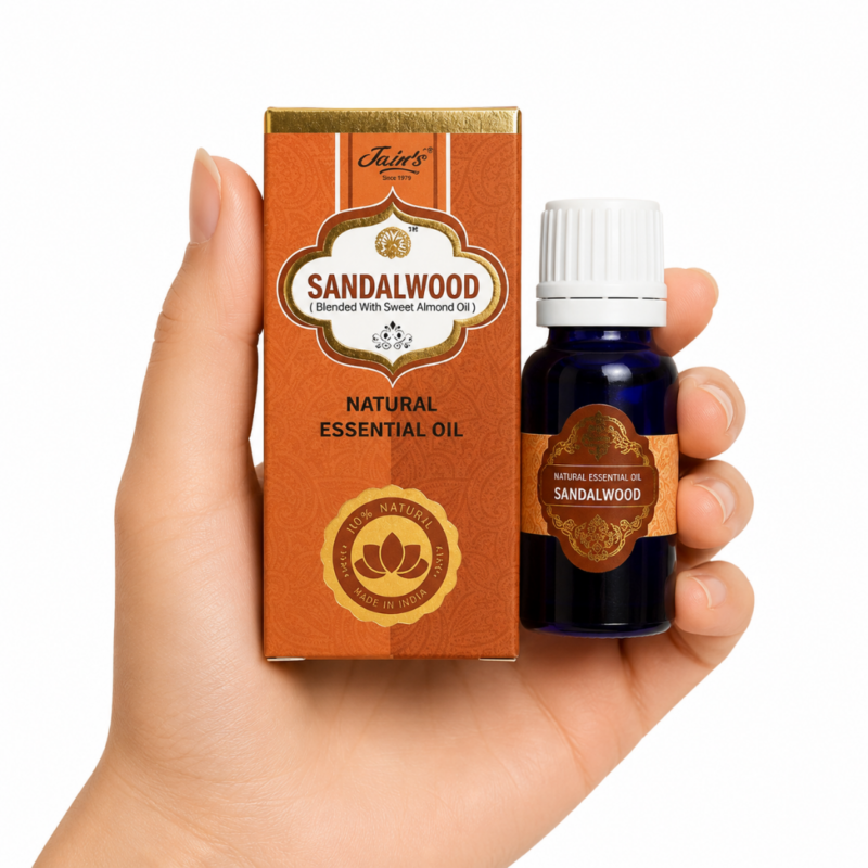 Aceite Esencial de Sándalo Jain's 100% natural con caja color sándalo y frasco de vidrio azul sobre fondo blanco.