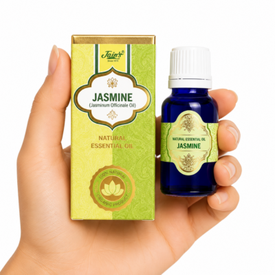 Aceite Esencial de Jazmín (Jasmine) Jain's 100% natural con caja verde y dorada y frasco de vidrio azul sobre fondo blanco.