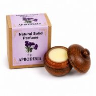 Perfume Sólido Natural Aprodesia Jains de 6 g con envase de madera reutilizable y caja original sobre fondo blanco.