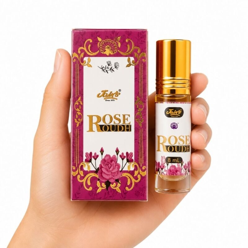 Rose Oudh Attar en presentación de 8 ml junto a su caja, una fragancia concentrada que combina el carácter floral de la rosa con la profundidad aromática asociada al oudh.