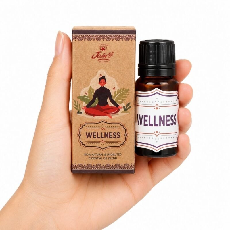 Mano sosteniendo las Gotas Mágicas Wellness de Jains con caja original sobre fondo blanco.